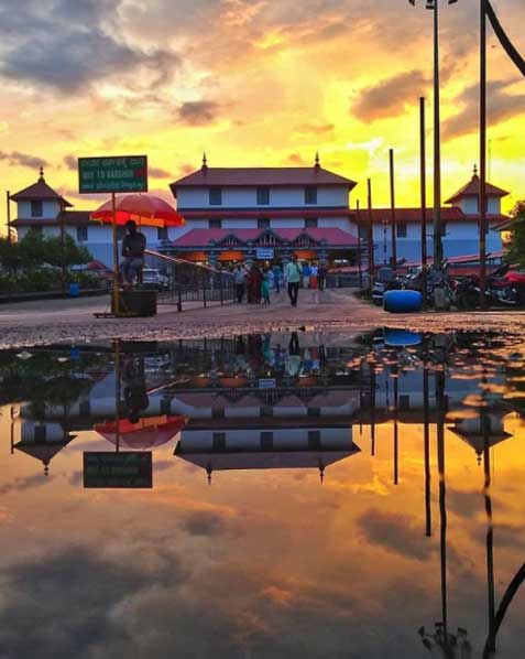 Dharmasthala Temple - a sacred abode of Lord Shiva in the Western Ghats, known for its intricate carvings, towering gopuram, and spiritual significance