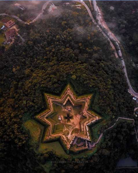 Scenic view of Manjarabad Fort nestled in the lush green mountains of Sakleshpur