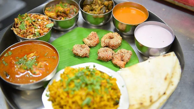 Indulge in the mouth-watering flavors of Malvani cuisine on your West Coast road trip.